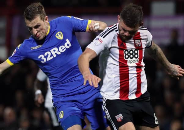 Chris Wood and Harlee Dean challenge for the ball in Leeds' defeat at Brentford in midweek