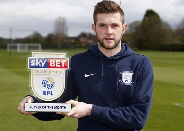 Tom Barkhuizen picks up his award as the Championship player of the month for March