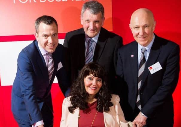Former Dragon Hilary Devey with the leader of Chorley Council, councillor Alistair Bradley, Dave Guest and Mark Downing from Scorpion Automotive