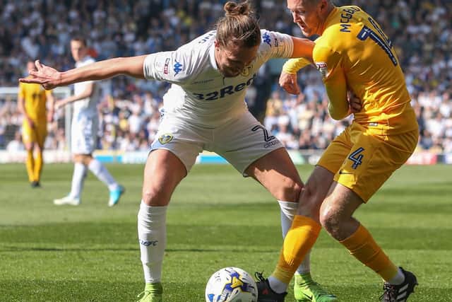 Aiden McGeady tussles with Luke Ayling for the ball
