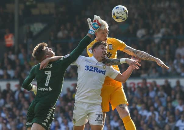 Simon Makienok battles in the air with Kalvin Phillips and Rob Green.