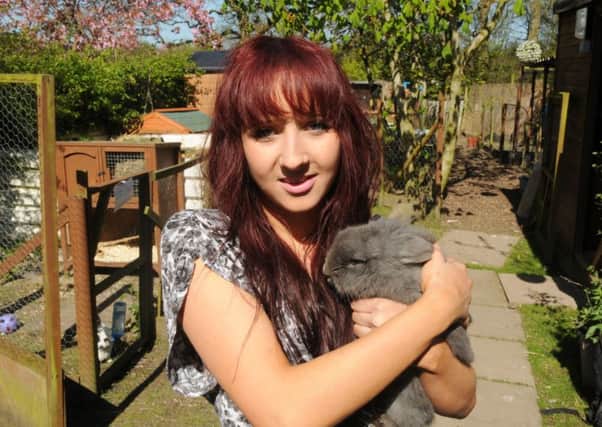 Becky Yates from Cottam pictured with a  rescued rabbits