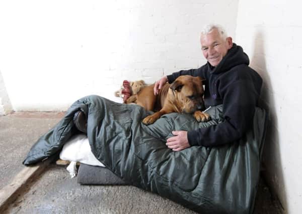 Leigh Ashton from Homeless Hounds with dog Brock. Leigh is taking part in a sponsored sleepover with the dogs in kennels.