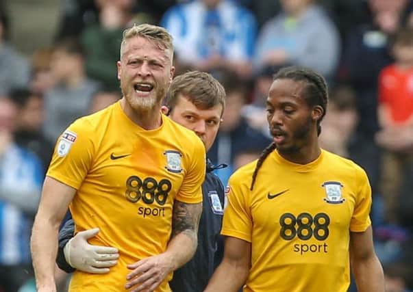 Preston captain Tom Clarke limps off at Huddersfield