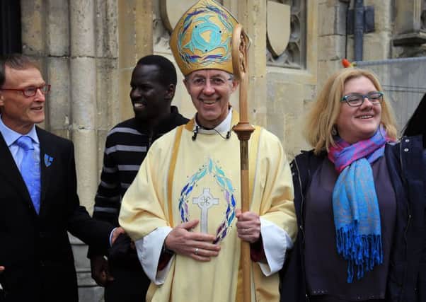 The Archbishop of Canterbury Justin Welby meets members of the congregation following the Easter service at Canterbury Cathedral in Kent. PRESS ASSOCIATION