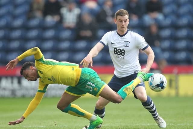 Preston North End's Marnick Vermijl battles with Norwich City's Josh Murphy.