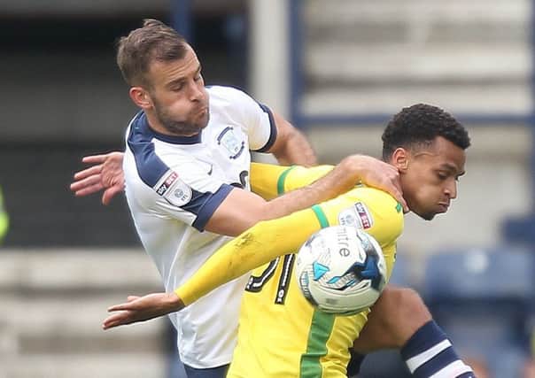 Tommy Spurr challenges Josh Murphy in PNE's defeat to Norwich at Deepdale