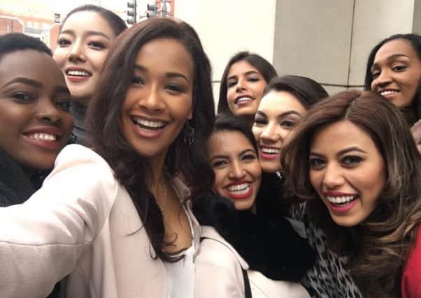 Lizzy Grant takes a selfie with other Miss World contestants in the US