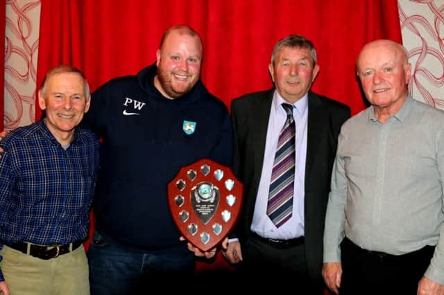 Paul Whelan, second left,  is presented with the Ashy Shield by from the left, Bernard McNaboe,  Dave Aspdens brother Michael  Aspden  and John Kerrigan, who donated the shield 	               PHOTO: Eamonn McNamara