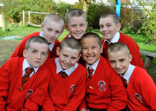 Photo Neil Cross
Year six pupils at St Bernard's Catholic Primary had  their heads shaved in school  to support classmate Oliver Kearney, who is having an operation at Alder Hey