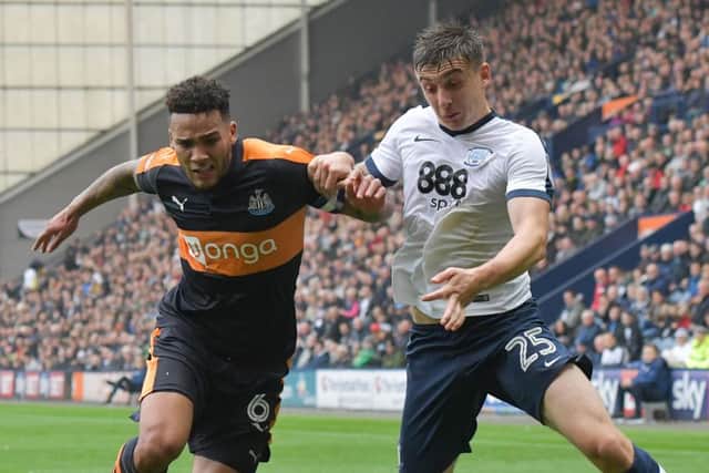 Newcastle's Jamaal Lascelles with PNE's Jordan Hugill at Deepdale in October