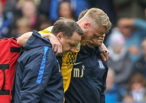 PNE skipper Tom Clarke is helped off after being injured at Huddersfield last week