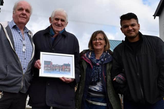 Artist Bill Southworth with his painting and Leyland Market traders