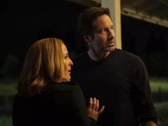 Gillian Anderson and David Duchovny as Mulder and Scully