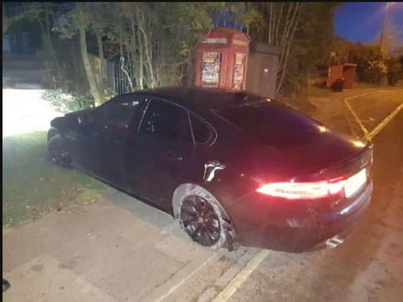 Three offenders made off from the stolen Jaguar
Pic: Lancs Police
