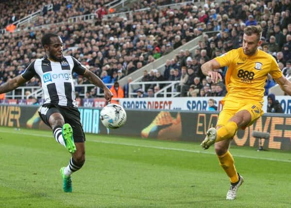 Tommy Spurr sends over a cross at St James' Park.