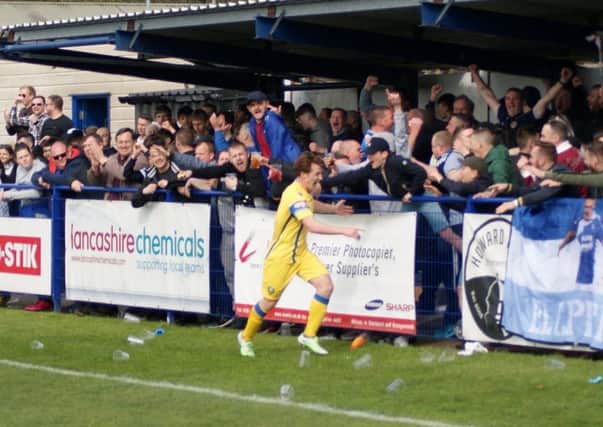 Craig Carney celebrates scoring Lancaster City's fourth goal against Glossop.