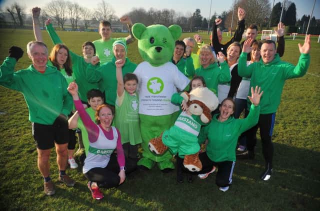 Event organiser Chris (also known as Jack) Horner (left of the bear) promotes the Garstang Gallop, a charity run to raise funds for The Royal Manchester Children's Hospital, pictured with friends, members of Garstang Running Club and the charity mascot.