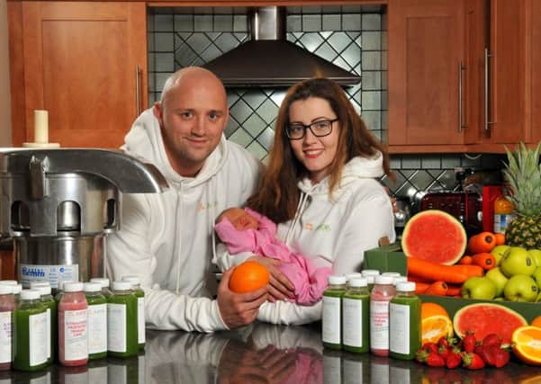 Photo Neil Cross
Martin Ainsworth and fiancee Shelby Rigg have set up We Are Juice juicing business that is going from strength to strength.
They have decided that for every sale, they are going to give fruit/veg/juice to the homeless people or food banks in the local area. Pictured with three day old daughter Brooklyn
