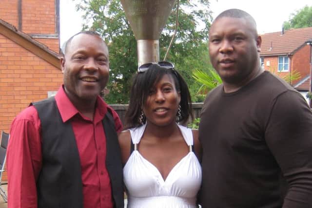 Errol Bennett (left), murdered in Jamaica, photographed at home in Preston with daughter Zoe and son Errol Jnr.
