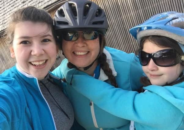 Sarah, Karen and Kiera Boyes pictured preparing for last year's sponsored cycle ride