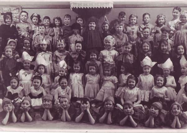 Taken from Ann Burgess's collection oflSt Joseph's Catholic Primary School in Lancaster. This picture shows children gathering for a concert at Christmas.