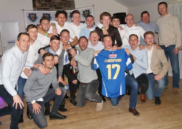 Lancaster City celebrate their title win at their end of season presentation on Saturday night.