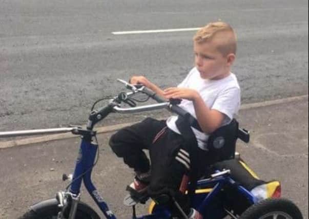 Keaton Seed on his special trike which was stolen from outside his home in Brackenbury Road, Fulwood