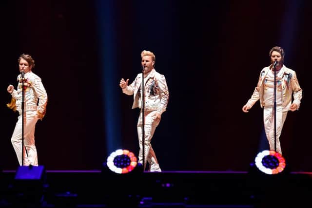 BIRMINGHAM, ENGLAND - MAY 05: (L-R) Mark Owen, Gary Barlow and Howard Donald of Take That perform on the opening night of Wonderland Live 2017 at Genting Arena on May 5, 2017 in Birmingham, United Kingdom. (Photo by Dave J Hogan/Dave J Hogan/Getty Images)