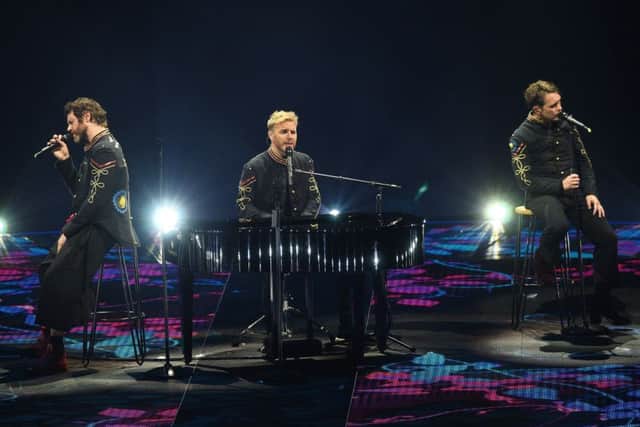 BIRMINGHAM, ENGLAND - MAY 05:  (L-R) Howard Donald, Gary Barlow and Mark Owen of Take That perform on the opening night of Wonderland Live 2017 at Genting Arena on May 5, 2017 in Birmingham, United Kingdom.  (Photo by Dave J Hogan/Dave J Hogan/Getty Images) *** Local Caption *** Howard Donald; Gary Barlow; Mark Owen