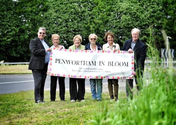 Picture by Julian Brown 19/05/17

Members pictured left, Melvin Gardner, Dorothy Gardner (chair), Linda Woollard, Jenny Hothersall, Joan Burrows and Dougie Gornall at the spot where they would like the feature.

Members of Penwortham in Bloom are appealing for Penwortham to have its own gateway feature like in Leyland.