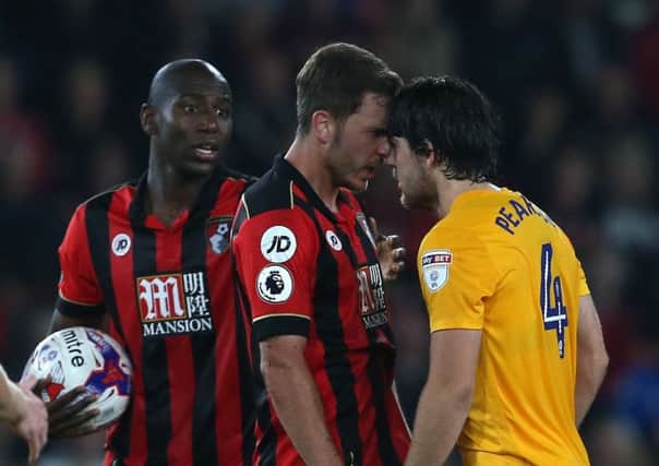 PNE midfielder Ben Pearson eyeballs Bournemouth's Dan Gosling in the EFL Cup clash