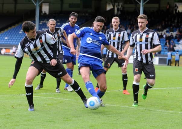 Halifax Town v Choley National Conference North Play-off Final at the MSI stadium Halifax.  Towns Scott Garner challenges Chorley's Adam Blakeman. Picture Tony Johnson.