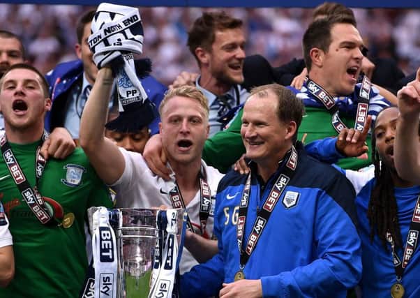 PNE skipper Tom Clarke and manager Simon Grayson celebrate at Wembley in 2015