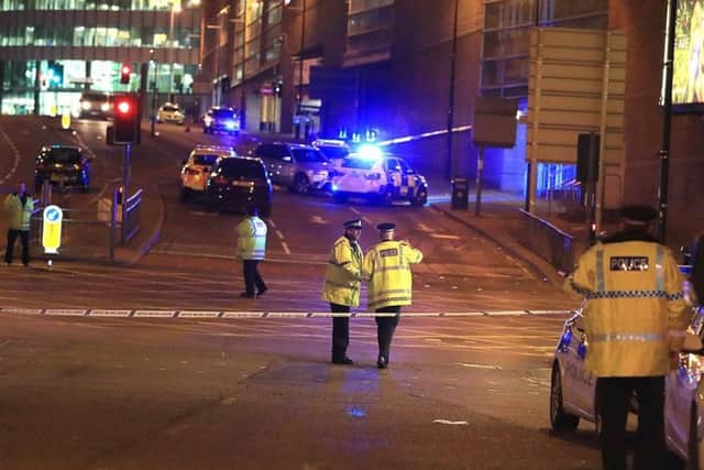 Emergency services at Manchester Arena after reports of an explosion at the venue during an Ariana Grande gig.