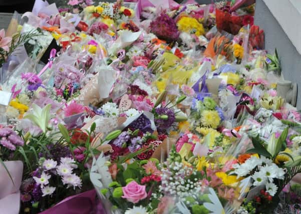 Floral tributes. Photo Neil Cross