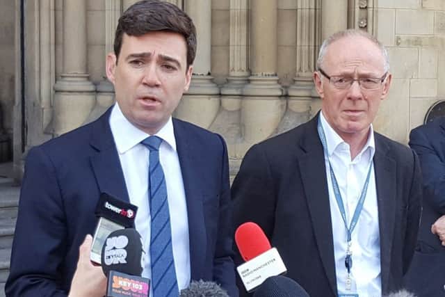 Mayor of Greater Manchester Andy Burnham and Manchester City Council Leader Sir Richard Leese speak to the media outside Manchester Town Hall