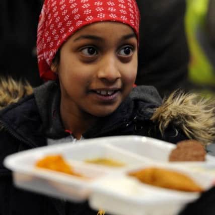 Members of the Sikh Society hold their first free food kitchen for the homeless and needy at Preston Flag Market. Sandeep Kaur help out at the kitchen. Picture by Paul Heyes, Sunday February 26, 2017.