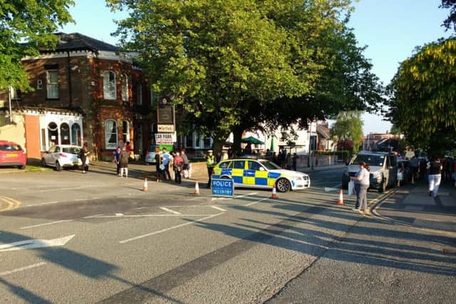 Handout photo courtesy of Paul Redrobe of police as they cordon off an area, which stretched on to Wigan Lane, near the Wigan Royal Infirmary