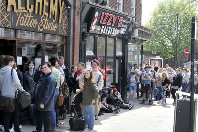 Queueing for a Manchester Bee tattoo in Wigan
