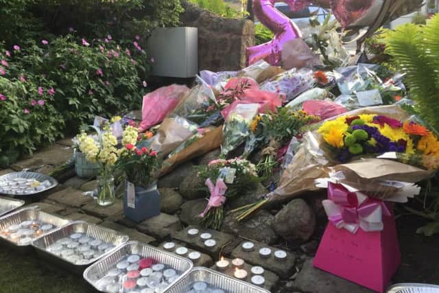 Flora tributes were left by hundreds of well-wishers