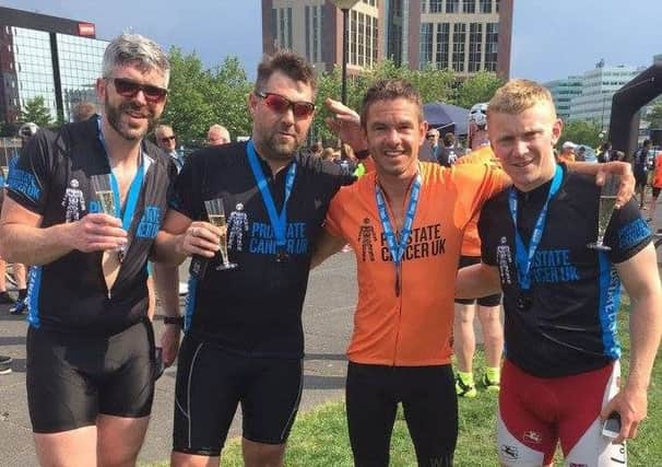 Luke Hemmings (right) with PNE fitness coach Tom Little (orange top) and two other riders in last year's ride to Amsterdam which raised money for Prostate Cancer UK