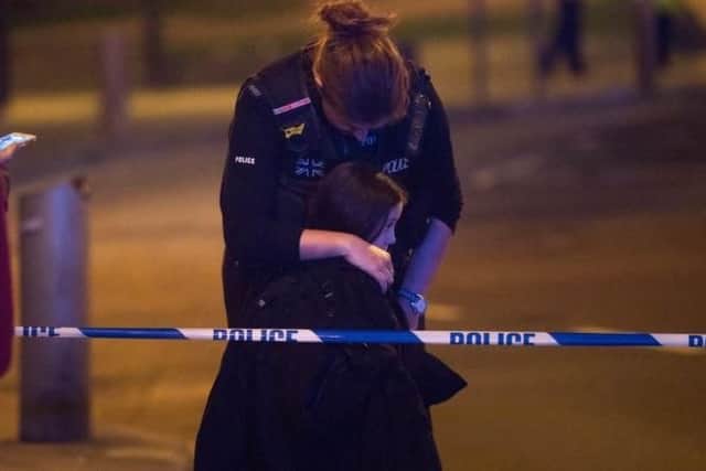Millie was pictured thanking the police officer who helped return her to her father on the night of the attacks