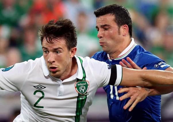 Sean St Ledger in action for the Republic of Ireland against Italy's Antonio Di Natale in Euro 2012