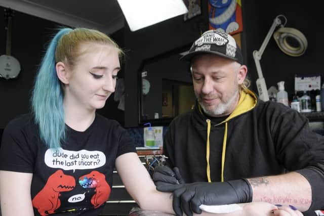 Studio 81 are doing bee tattoos for the Manchester appeal.  Pictured is Stu Nellas with Laura Beever Sutton.