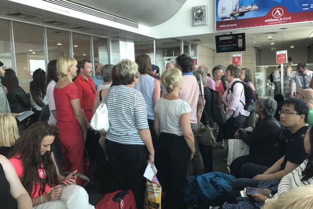 The singers break into song at the airport gate