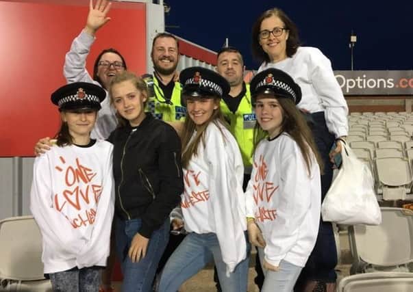 Sharon Hartley, back left, with Helen Kennedy, far right, with daughters Ella Hartley, Nina Kennedy with Erin and Caitlin McNeil, all from Catterall at the One Love Manchester concert.