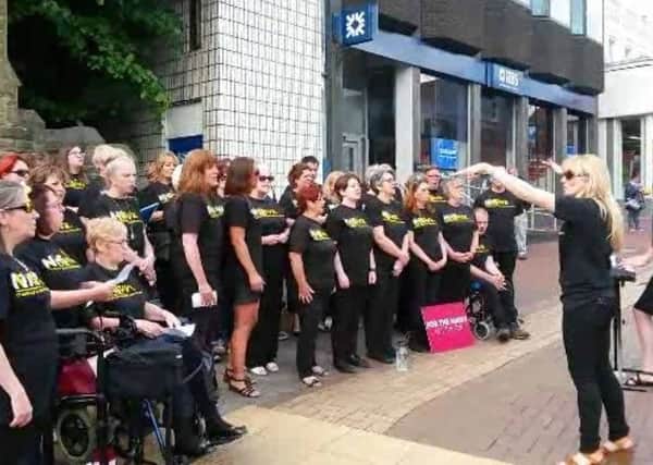 A&E campaigners singing Fix You with the Sing It Big choir in Chorley town centre