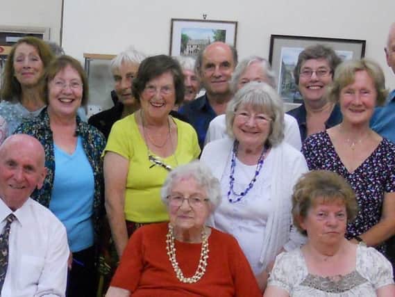 Anne Humphreys (centre in yellow) has died aged 85