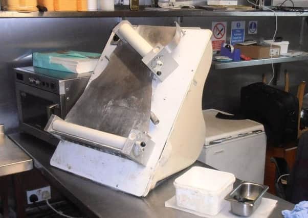 An unguarded dough roller at Mr Joe's takeaway on Church Street, Preston. The owner was fined Â£1,660 for health and safety offences